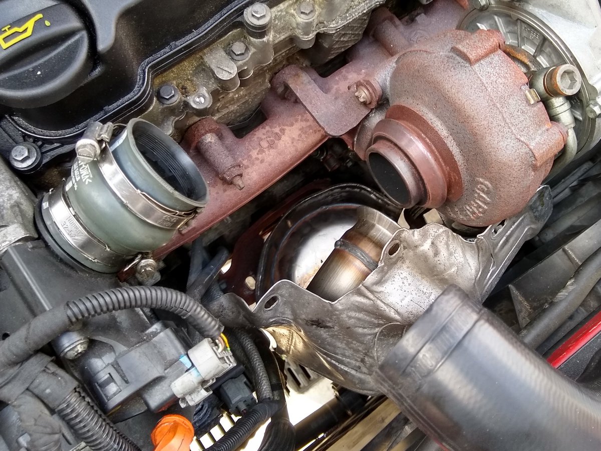Push the new DPF up through the bottom. Once it's about 3/4 of the way up, I like to come on top and pull it the rest of the way. Easier to wiggle into place. Loosely fasten the turbo clamp first so it doesn't fall on you later. Also makes it easier to line everything up.