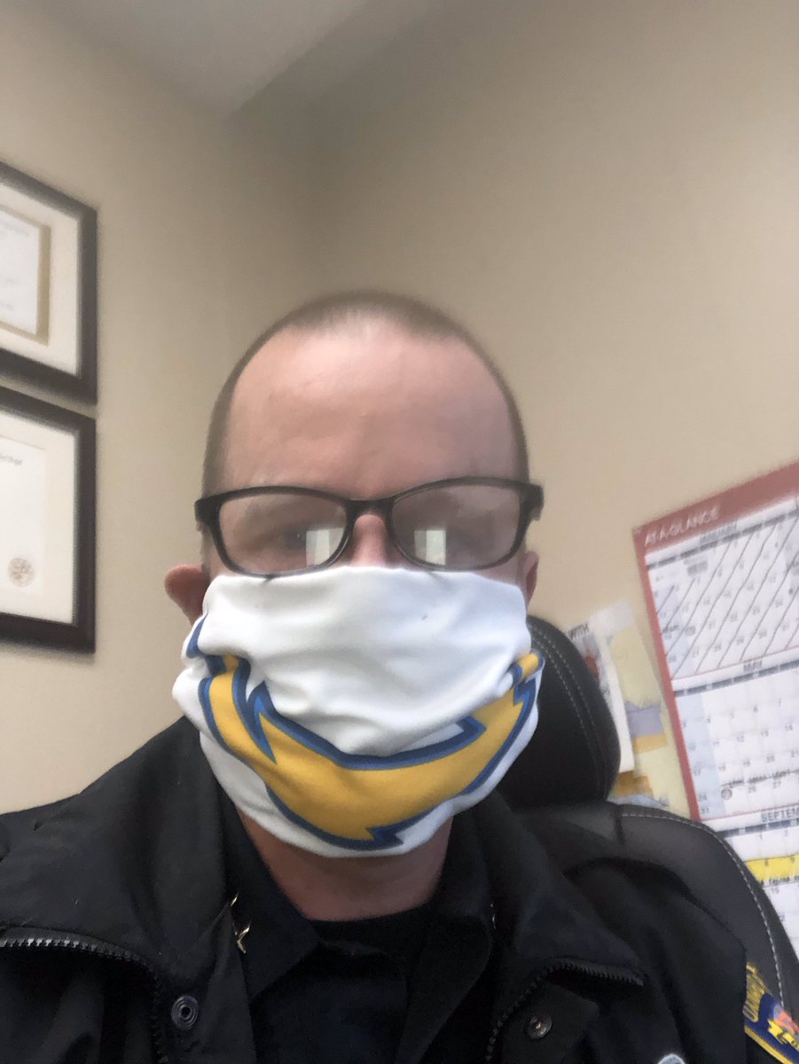 OPDACSonstegard's tweet photo. I’m in my office at the station but I’m still representing the @Chargers while covering my face and protecting the community. #OPDRocks
#FBINAAStrong&Resilient https://t.co/gsK2KOMsaX