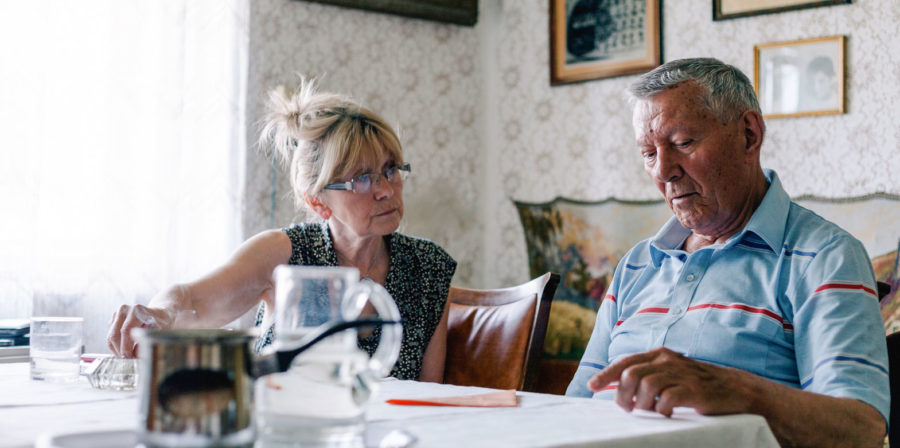 Stock image of two senior adults having a difficult conversation
