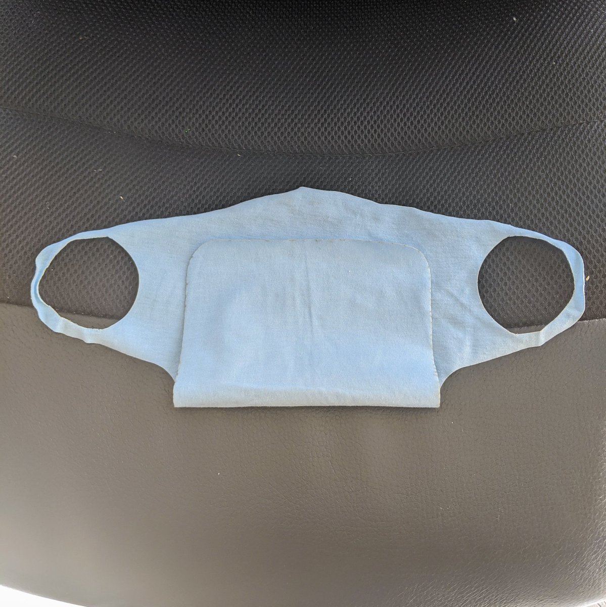 LaserMistress's tweet photo. Day 11 of 30 days of lasercutting. Simple mask from an old t-shirt. Cut in ~10 seconds. Design from the #Glowforge forums. You fold the extra part up and put material between. Gonna put a flexible LED matrix in there. #laserartist #womeninhardware https://t.co/mNXBpX5CEi
