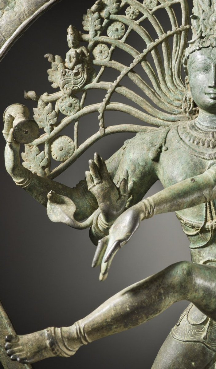 Shiva's lower right hand makes the abhaya-mudra [the 'fear not' gesture] that allays all fears & bestows protection.Shiva's front left hand [elephant hand-Gaja Hasta mudra] pointing to his raised left foot signifies release from the sufferings of Maya.