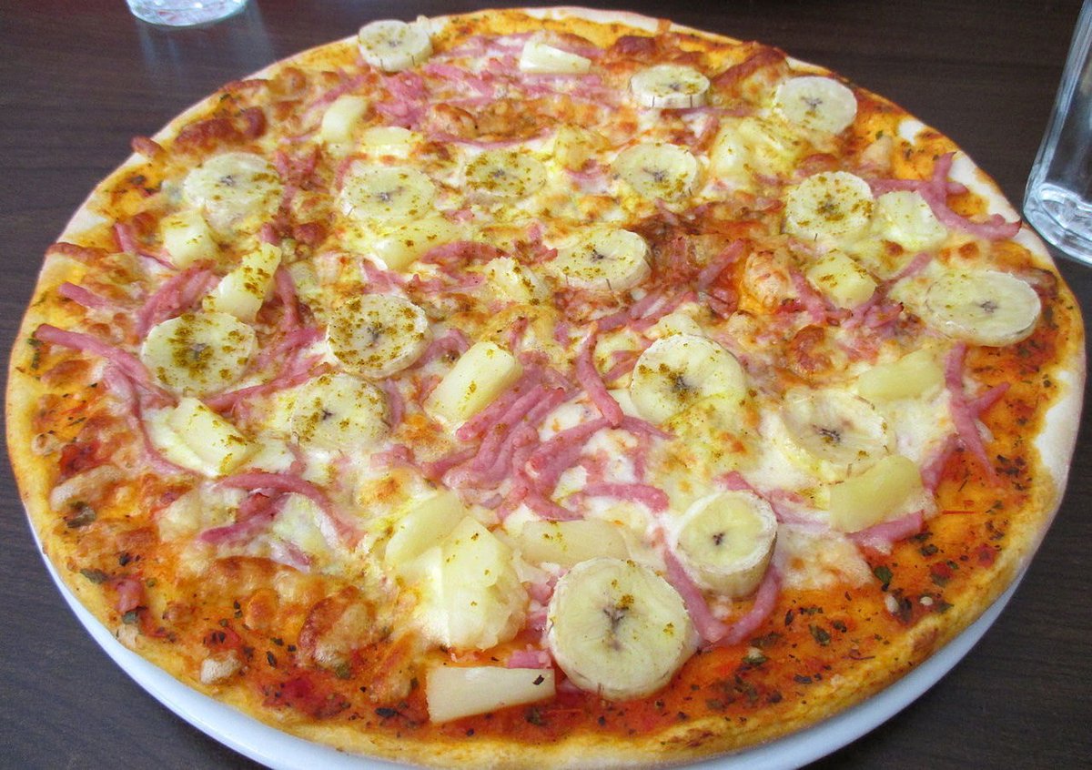 Banana, pineapple, ham and cinnamon pizza...This is one of our pro players go to toppings, can you guess who? Would you eat this pizza?