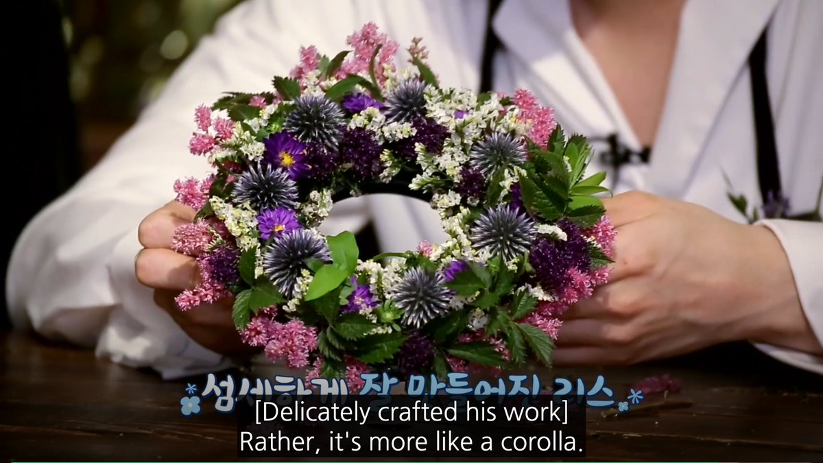 suga's wreath- progress for someone who didn't know what a wreath was- the symmetrical placement of flowers would make my teachers cry- good colours- u can see the foam MIN YOONGI 1000 YEARS OF FLORIST JAIL- good hole/material ratio (shut up)8/10 it cute