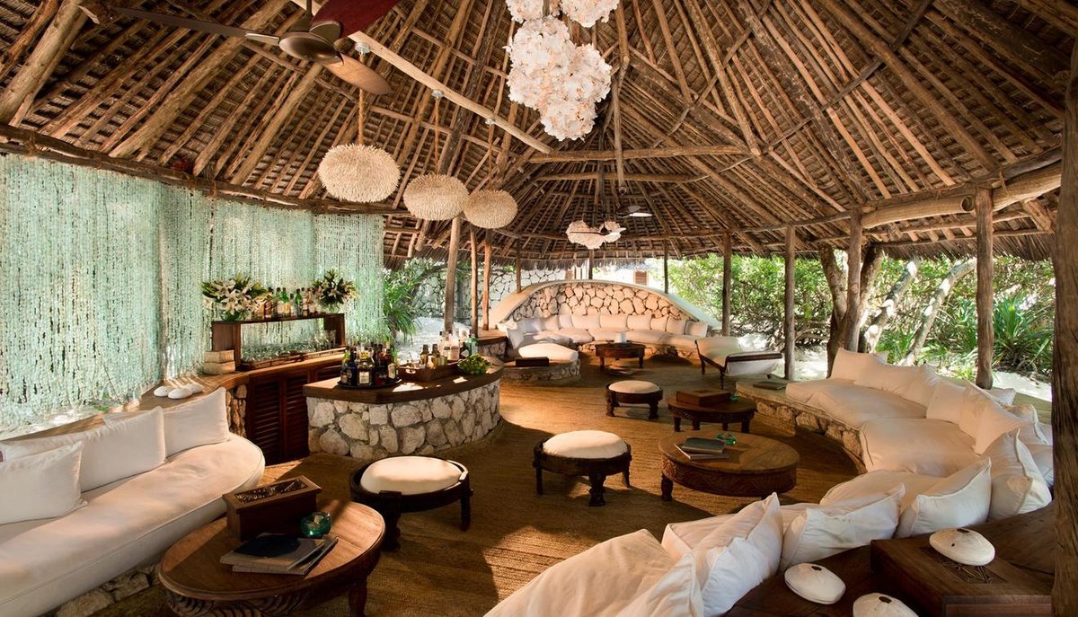 SouthernDest's tweet photo. Reached by an unpaved road through spice plantations to #Zanzibar’s northern tip and then wading into the warm ocean for a short boat ride, #Mnemba really is away from it all and, with just ten guest bandas on the whole island, it really does feel like your own private paradise. https://t.co/1vIf51V1ve