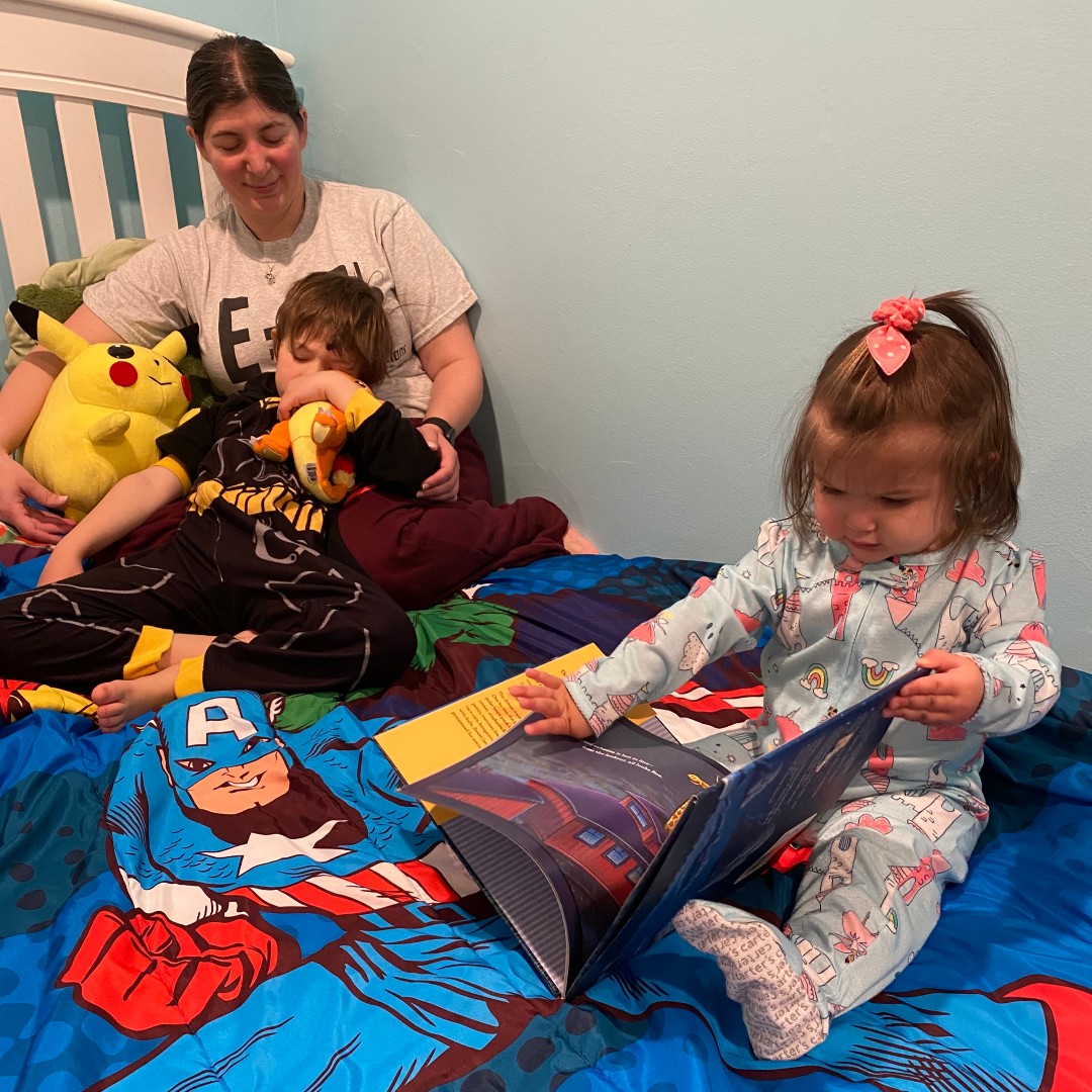 Mrs. Basile and her son are a little TOO cozy as they listen to the littlest of the group read a story 😂 #cmpositivity #cmvirtualspiritweek #letsseecm