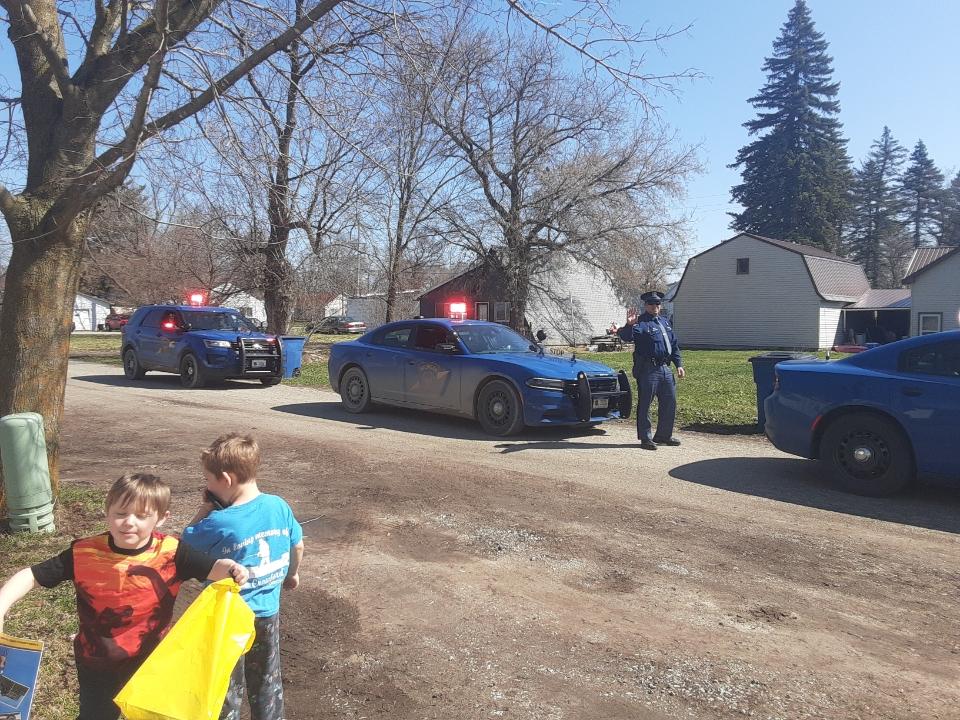 Members of the Michigan State Police continue to  #DoMIpart during the  #COVID19 emergency. Here’s a look at the  #ViewFromMyOffice of West Branch Post Troopers Noble, Landman and Good providing Service with a Purpose in a birthday parade for a six-year-old boy in Iosco County.