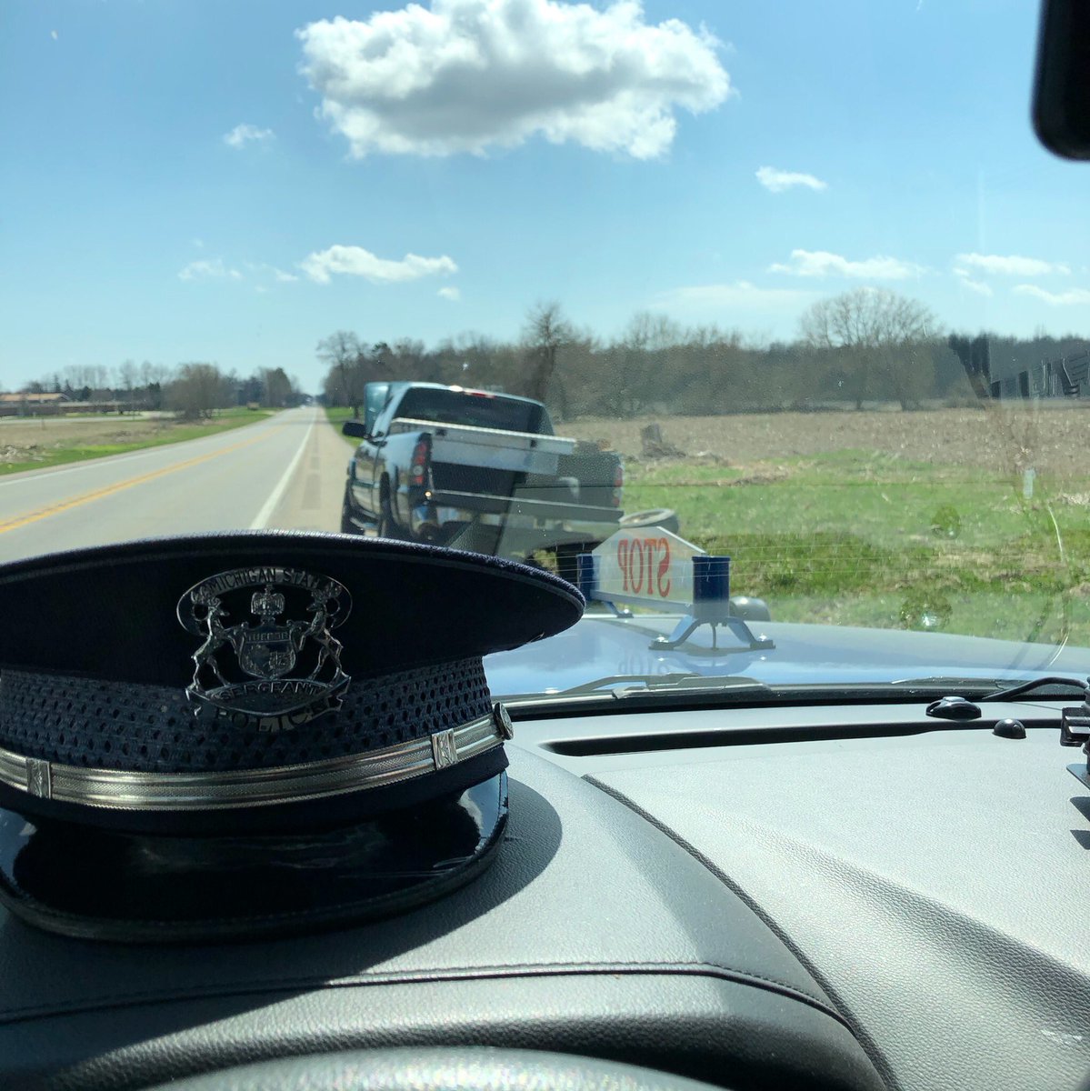 Members of the Michigan State Police continue to  #DoMIpart during the  #COVID19 emergency. Here’s a look at the  #ViewFromMyOffice of Sergeant Metivier assisting a motorist in Montcalm County.