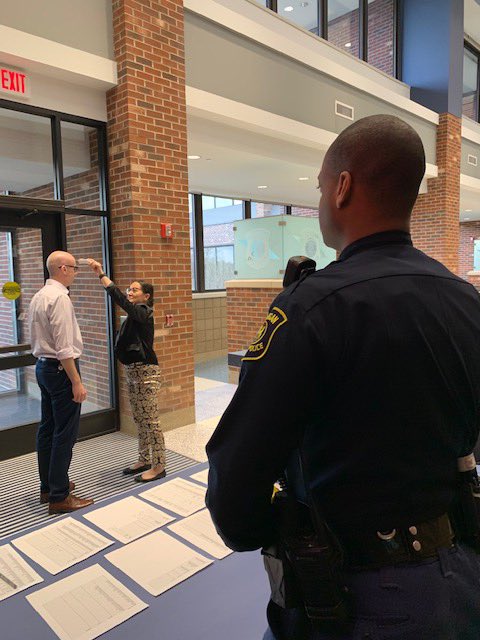 Members of the Michigan State Police continue to  #DoMIpart during the  #COVID19 emergency. Here’s a look at the  #ViewFromMyOffice of Sec. Ofcr. Andre Hornbuckle monitoring employee check in at the State Emergency Operations Center, while a pharmacist initiates a health screen.