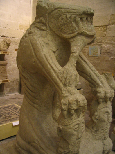 Depictions of wolves by Celtic artists not uncommon. The Tarasque de Noves stone carving from France, 2nd/3rd C BC, 1.12m high, consists of half-lion/half-wolf monster with human bone in mouth! Front paws grip 2 human heads with eyes closed in death! Attributed to Cavares tribe.