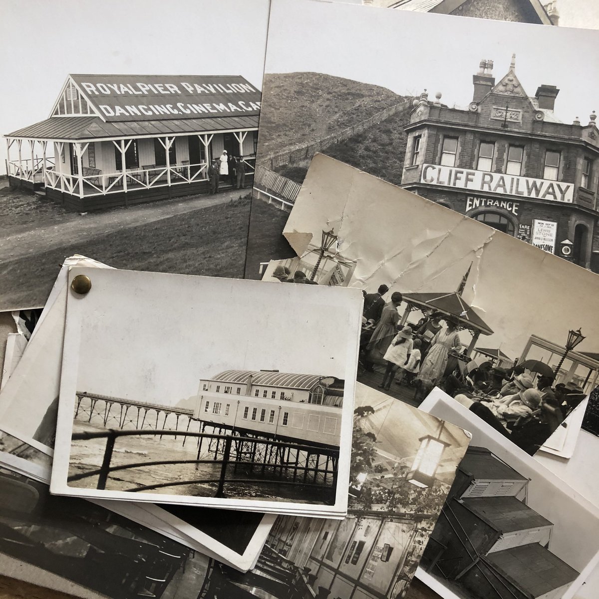 Amongst Mum & Dad’s photos there’s an envelope of pictures - some originals, some reproduction cards - of Aberystwyth Pier & Cliff. c.1929 I think. Before their time. No idea whose they are but lord, they’re lovely  #Aberystwyth  @pplscollection