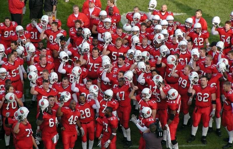 BallStateFB's tweet photo. It's #ThrowbackThursday‼️

Colin Johnson (@CoachJohnson64) was a 4-year letterwinner at BSU (1999-2002), highlighted by starting 3 years at Center and representing the Cards as a team captain during his senior season!

More about our very own OL Coach ➡️ https://t.co/imLSPRIjom https://t.co/bZD2sbwnPv