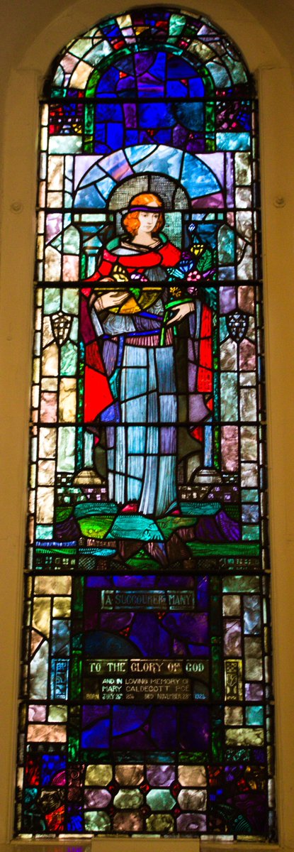 Stained glass windows flank this; on the left is “Phoebe” & on the right (a WWI memorial window) is “St. Michael”. A 3rd window depicts “Job, Fortitude, St John Baptist, & Justice” – in memory of the Poë family & Charles Vernon who died in the 1st World War. All 3 of these (4/7)