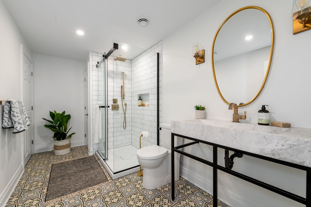 When your basement bathroom is the one everyone wants to use!  This stunner combines classic brass fixtures and patterned floor tiles to create a modern but timeless look.
#theartofrenovation, #ottawadesignbuild #tilelove