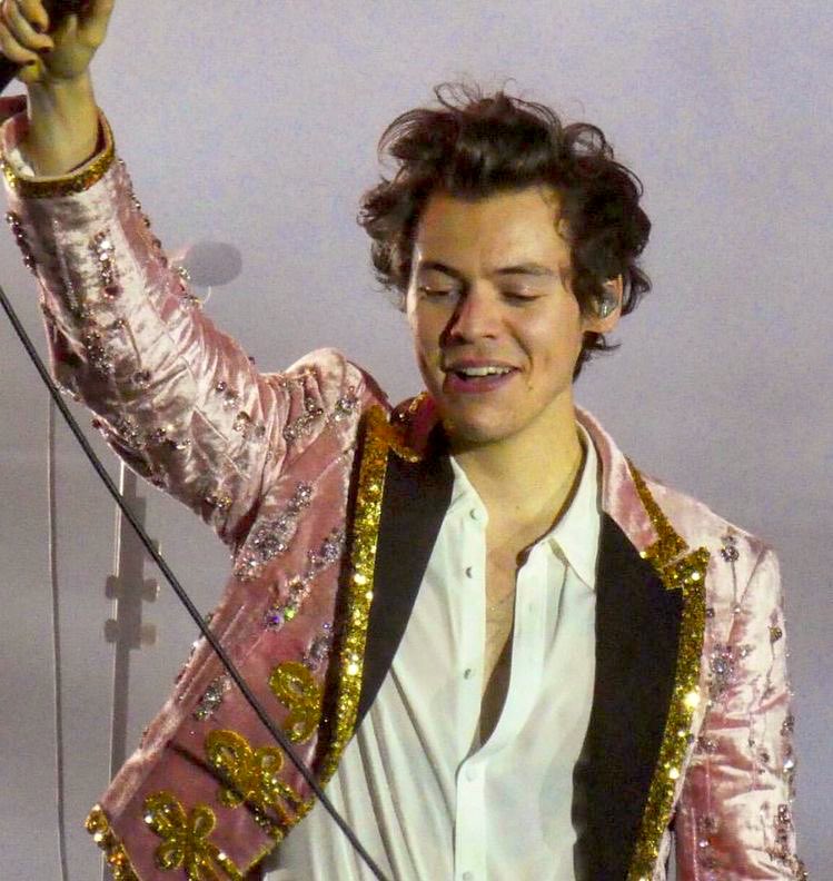 harry styles in this pink and gold sparkly gucci suit; a thread