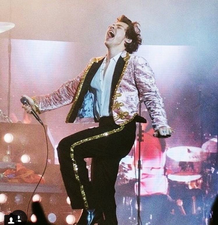 harry styles in this pink and gold sparkly gucci suit; a thread