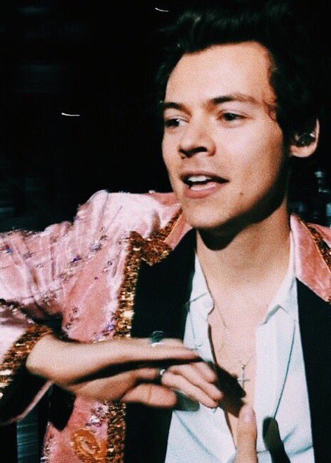 harry styles in this pink and gold sparkly gucci suit; a thread
