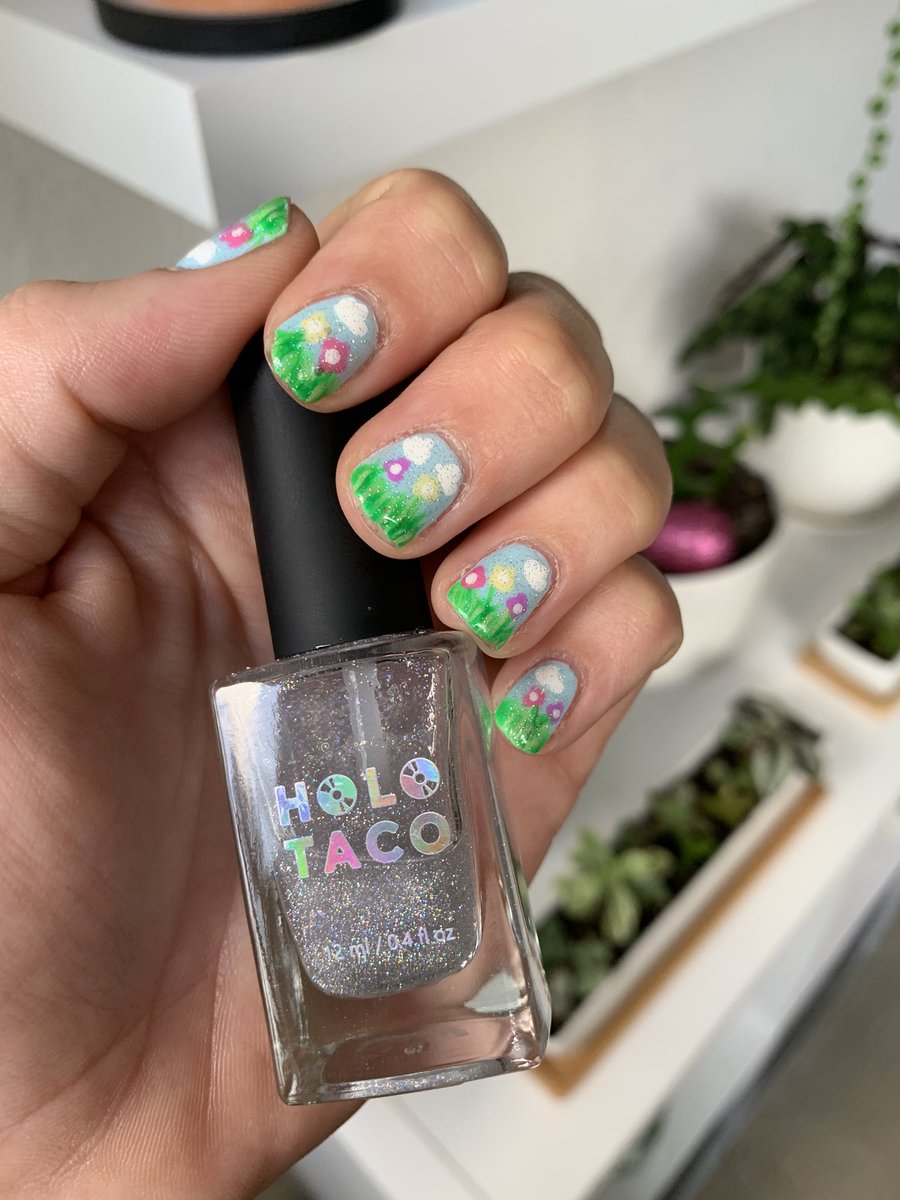 #holotacospringnailart used #notmilkywhite and topped it off with some #scatteredholotaco for this spring time look☁️💐💐☁️ @holotaco @nailogical