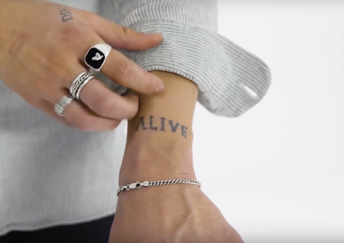 𝗔𝗟𝗜𝗩𝗘: Calum has never explicitly said the meaning of this tattoo, but once in an interview he revealed that he used to own a necklace from the brand The Giving Keys which said “alive.”