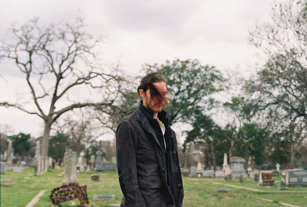 Only he would do a photoshoot at a cemetery!