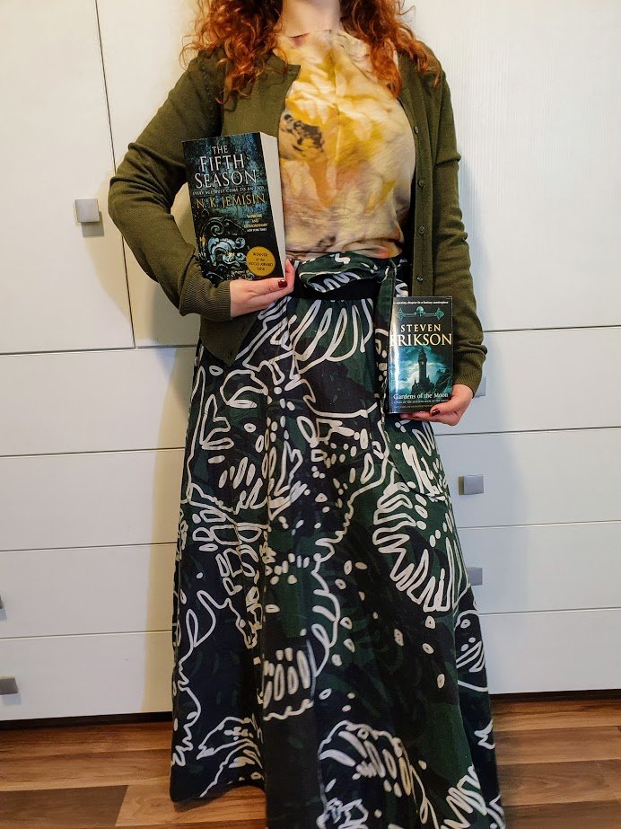 Book covers as outfits!The Fifth Season- N.K. Jemisin & Gardens of the Moon- Steven Erikson (skirt by me)Orconomics- J Zachary Pike (dress me) A Natural History of Dragons- Marie Brennan (skirt me)The Ninth Rain- Jen Williams & Realm of Ash- Tasha Suri