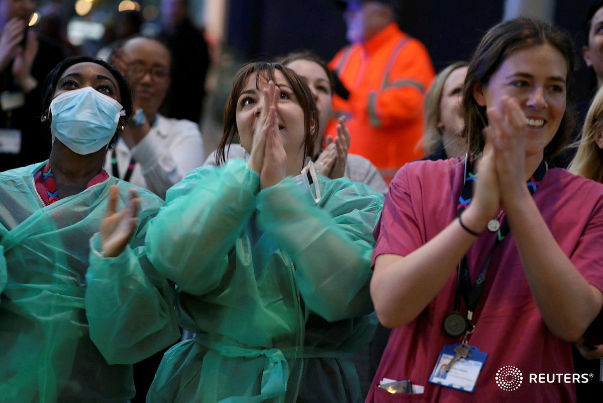 NHS workers applaud outside Chelsea and Westminster Hospital during the Clap for our Carers campaign in support of the NHS as the spread of the coronavirus disease (COVID-19) continues, London, Britain, April 9, 2020. REUTERS/Kevin Coombs