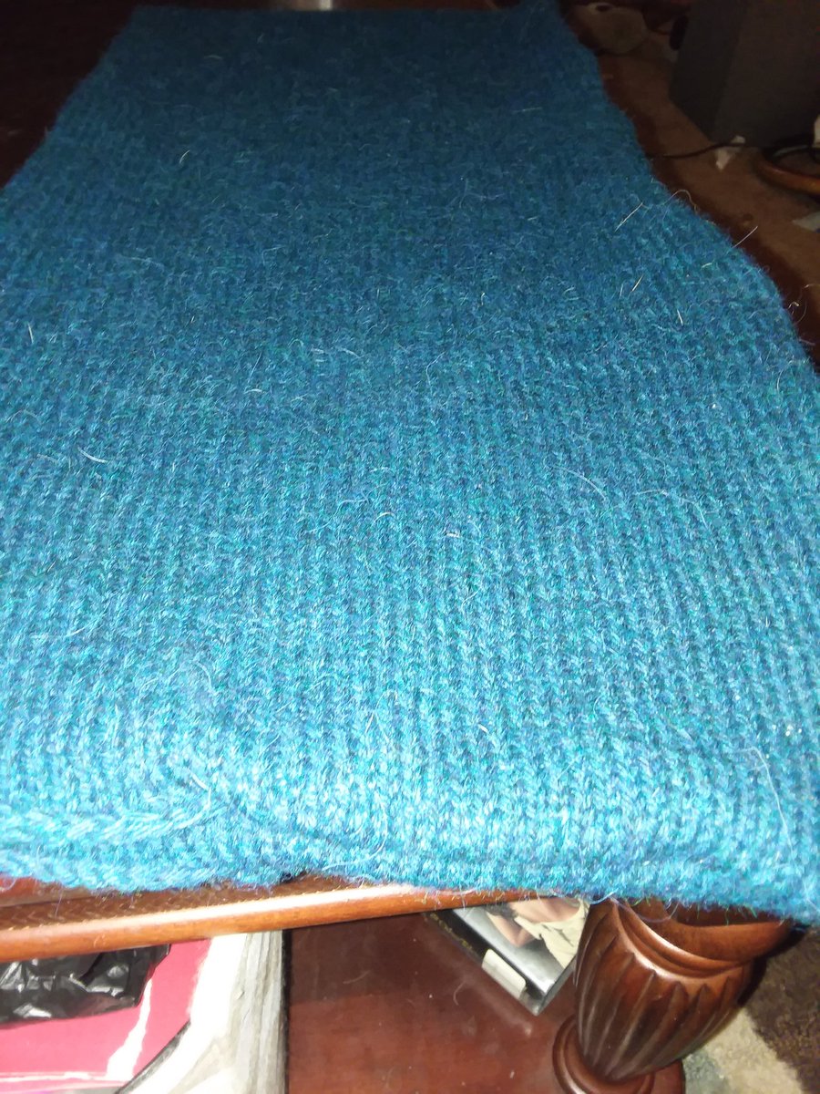 I finish the main piece and curse the existence of mattress stitch. (Dear gawd. Why does wool snap when you are just trying to tighten an f'ing seam?!)I learn how to block using hardback books. ( I so need a blocking board and pins.)