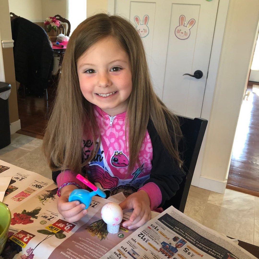 Hannah coloring Easter eggs in her PJ's!  #cmpositivity #cmvirtualspiritweek #letsseecm