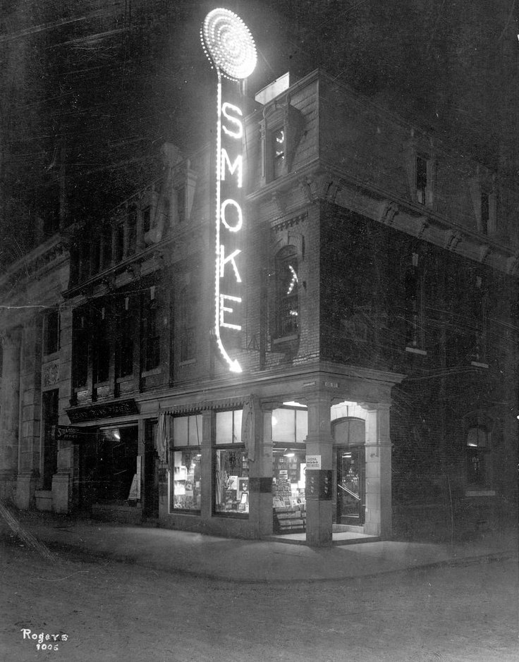 After turning to real estate, Gariepy leased the corner retail space to Déchène & McNeil, who operated a cigar store. Love this c.1914 night image and marquee.  • A6511