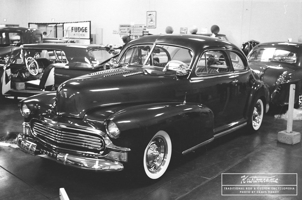 A mildly restyled Chevrolet Coupe from the James Handy Collection on Kustomrama. Taken at the 1962 San Jose Autorama, front end modifications include a louvered hood, frenched and tunneled headlights, a 1953 Chevrolet grille surround, and a tube grille: bit.ly/2ZmJOeV