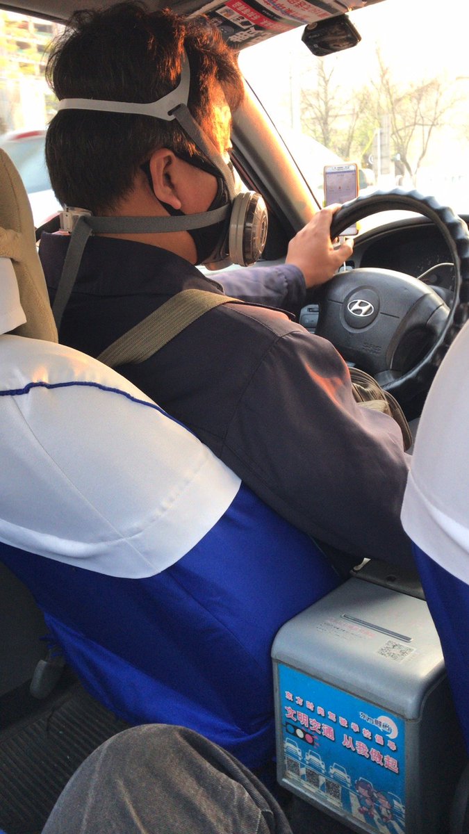 ...picture I will end this with is of my taxi driver on the way home. Judging by his mask he clearly remains prepared for whatever else Beijing might throw at him in the way of disease.