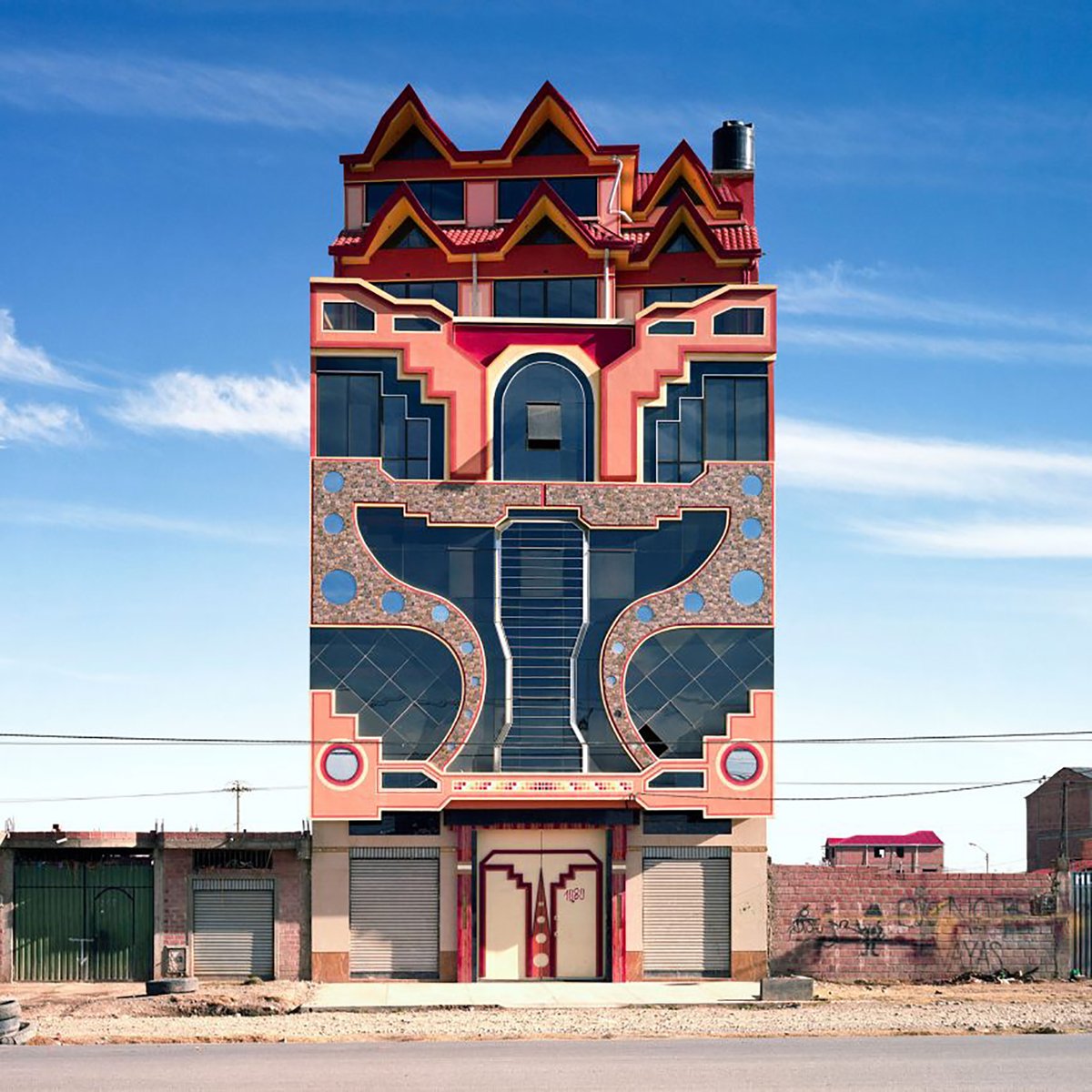 #ArchitectureFriday | @camille_walala returns to share the buildings which give her the most joy 🧡 Today's it's the work of Bolivian architect, Freddy Mamani. His bold colours and patterns take inspiration from the Andes. Discover more on Instagram > fal.cn/37oK0