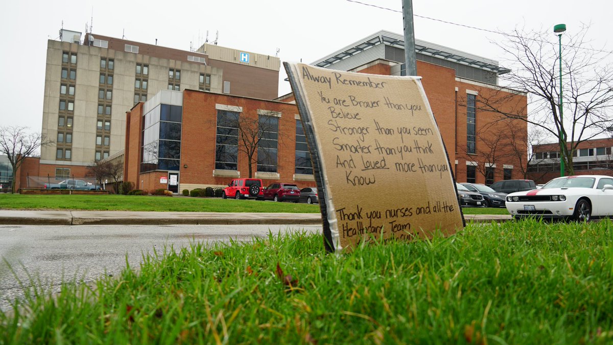 A wet piece of cardboard with a few lines in black marker, stands out like a billboard. “Thank you nurses and all the healthcare team.”