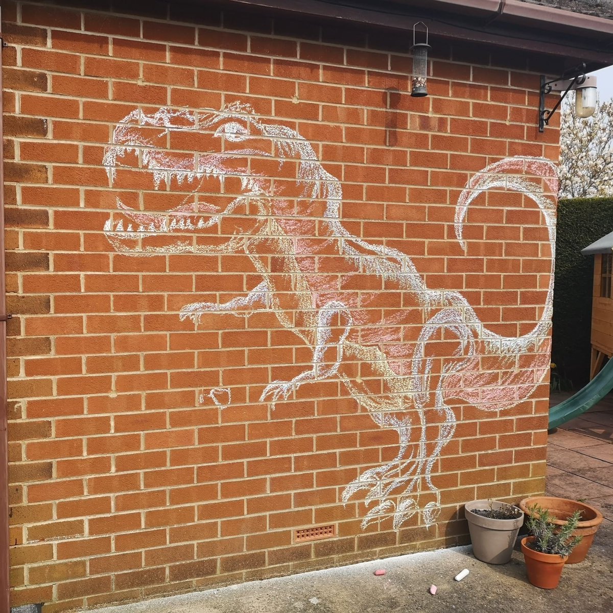 original_jammy's tweet photo. Started chalk drawing on the garden path with my son, he got bored I got carried away!
#StayHome #chalkart #dinosaur #trex #gardenlife https://t.co/P3wGprG2aS
