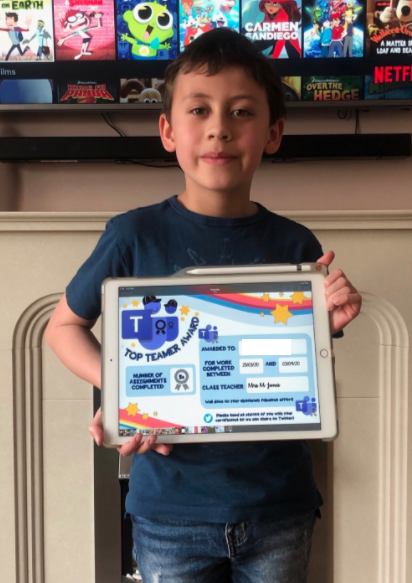 BroBanw's tweet photo. Two pupils proudly showing off the certificates they received for handing in some excellent work through Teams! Well done boys 🌈🌈 @HwbNews @ErwCymru https://t.co/iJF4LmBDdr