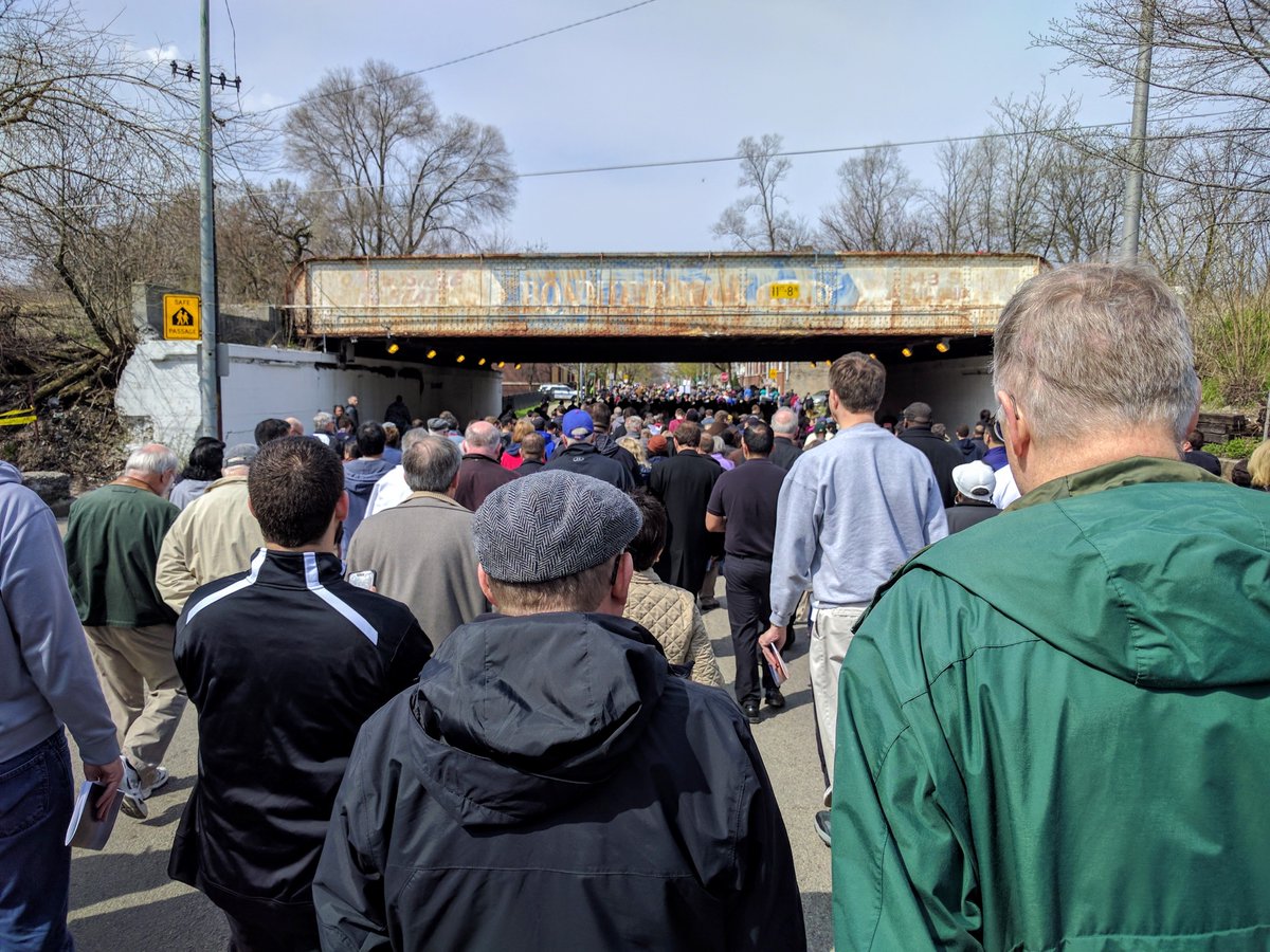 Several stations of the cross were said outside St Benedict. Cupich read an opening line, then names of Chicago shooting victims since Jan 1 were read, a layman read Scripture, Cupich said a prayer, then we sang. Finally, the actual walk began.