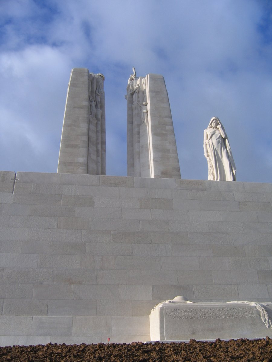 Below her is the empty tomb and two sets of figures know as The Defenders: The Breaking of the Sword (left) and Sympathy of Canadians for the Helpless (right). Above each group are cannons, now silent and draped in laurel and olive branches, the symbols of Victory and Peace.