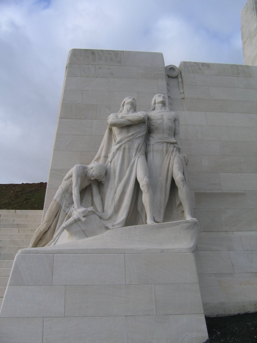 Below her is the empty tomb and two sets of figures know as The Defenders: The Breaking of the Sword (left) and Sympathy of Canadians for the Helpless (right). Above each group are cannons, now silent and draped in laurel and olive branches, the symbols of Victory and Peace.
