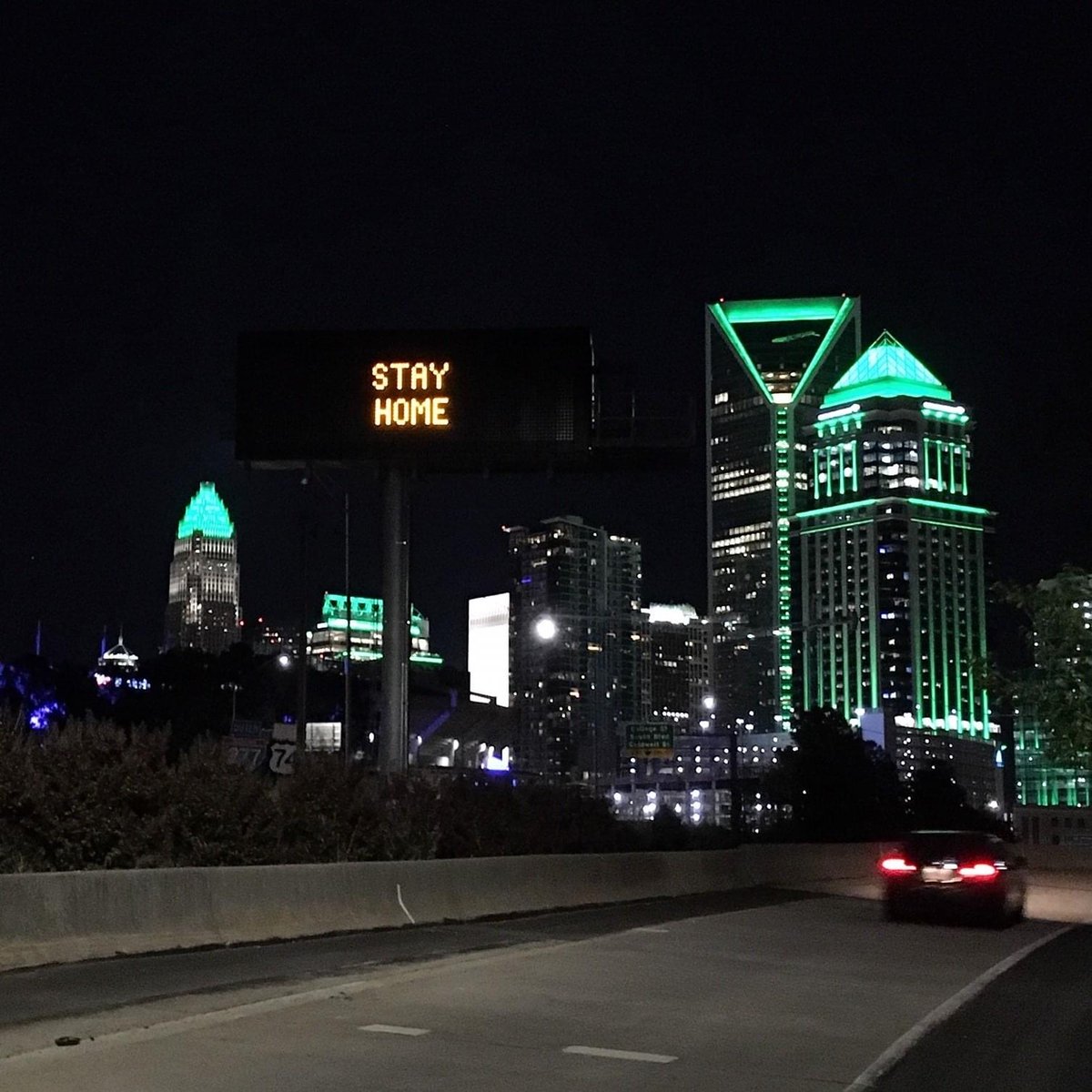 charlottefire's tweet photo. The Charlotte skyline lit up Green for First Responders and Healthcare Providers who are in the battle with COVID-19. Thanks to everyone for helping us keep you safe! #weareinthistogether https://t.co/iAxSd0bUjd