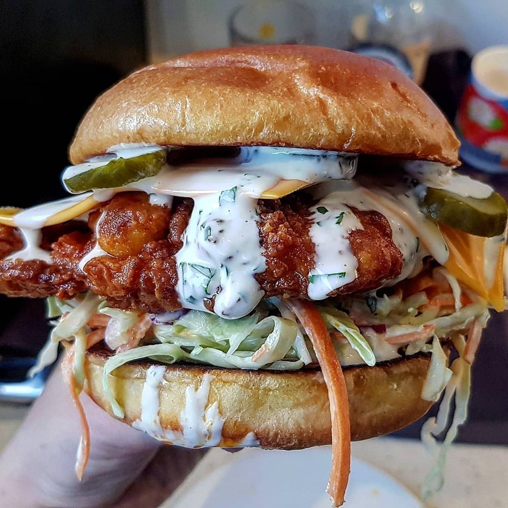 sandwichrecipez's tweet photo. Apparently this belongs in sandwiches - nashville hot fried chicken, lime slaw, cheese, dill pickles, lime and coriander sauce https://t.co/tSBwGaqFk9