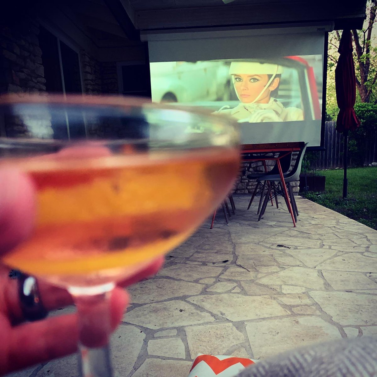 Outdoor Movie Night feat. HOW TO STEAL A MILLION and a Boomerang cocktail (Gin/Vermouth/Maraschino/Angostura). My favorite romantic heist of all time!! 😍 #backyardmovie #GivenchyGoals