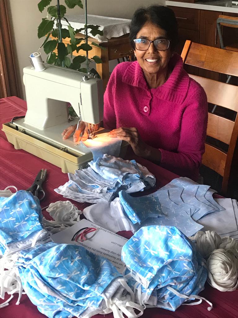 rishimahalaha's tweet image. My badass retired MD mom making masks for healthcare workers #GirlBoss #docsneedgear