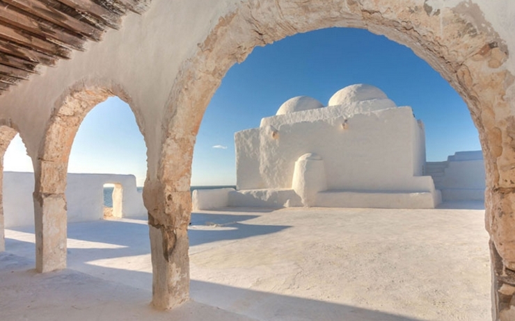 The South: Djerba's Ibadite architecture The island Djerba is known for its strikingly white simple Ibadite mosques and its houses that contrast with its crystal blue beaches.Similar architecture can be found in he city of Ghadames in Libya.