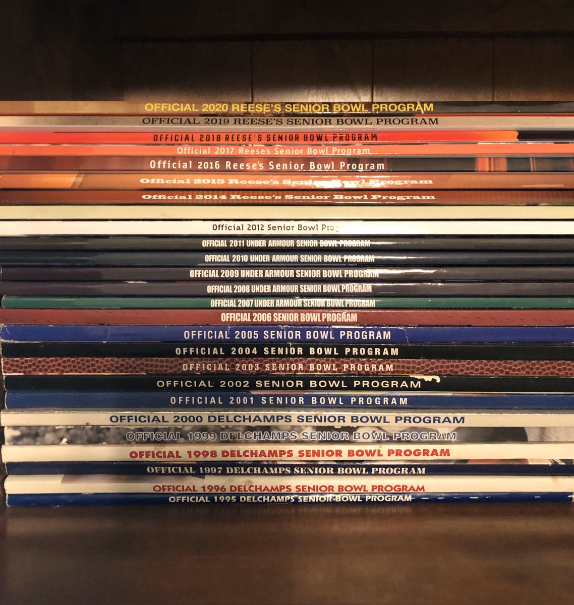 DerekQualls's tweet photo. I’ve been to  a Senior Bowl or 2. @JimNagy_SB has brought this game to a totally different level. Outstanding!! This is my prized collection. But I can’t understand the 2013 program and it’s blank spine. Gotta be a print error? @NFLDraft starts in Mobile! https://t.co/phzZwwN8ap