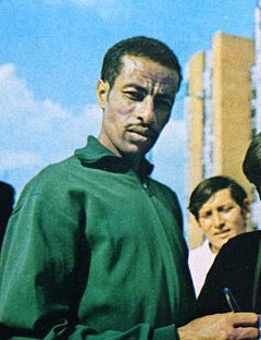 And by 1955, he had 500 stores across Japan. In order to further grow his brand and improve designs, he worked along side long distance runners; Toru Terasawa (left) and Abebe Bikila (right)