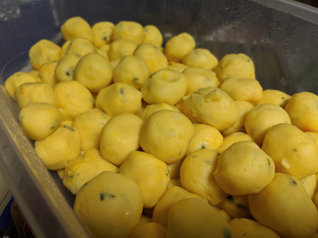 Step 2: Once the potato-cheese mixture cooled, we rolled them into little balls and stored them in the fridge overnight.Each of these will be the filling for a perogie.