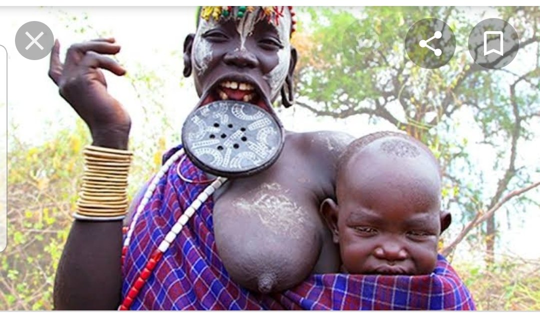 6.Lip stretchingWhen a girl becomes a teenager in the Surma tribe of Southern Sudan, she begins the process of lip stretching. The girl has her bottom teeth removed to make space for a lip plate, which is increased in size annually.