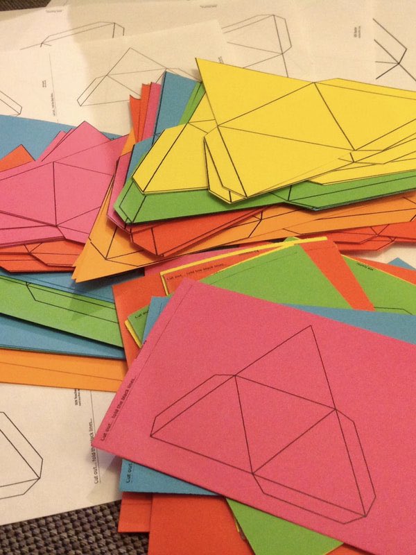 9) Explore the tessellating properties of A-sized paper and create some tetrahedron wall art.For instructions see my  #ArtfulMaths blog post here:  https://www.artfulmaths.com/blog/tetrahedron-wall-art  #3DMaths  #HandsOnMaths  #LockdownMaths  #ArtfulMaths