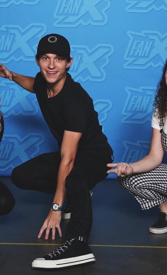tom holland doing the spider-man pose: a thread