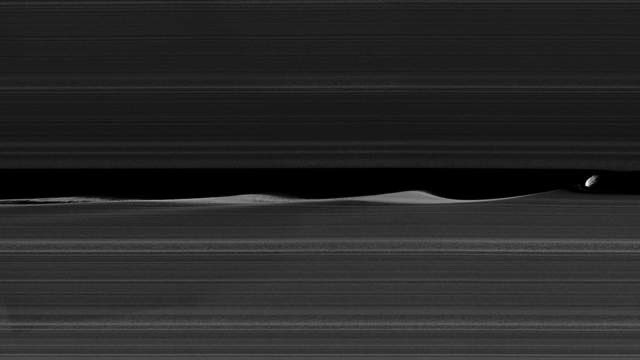 Moon thread? Moon thread. Daphnis as it travels through the rings of Saturn causing waves as it goesAll images are from NASA/JPL unless I say otherwise