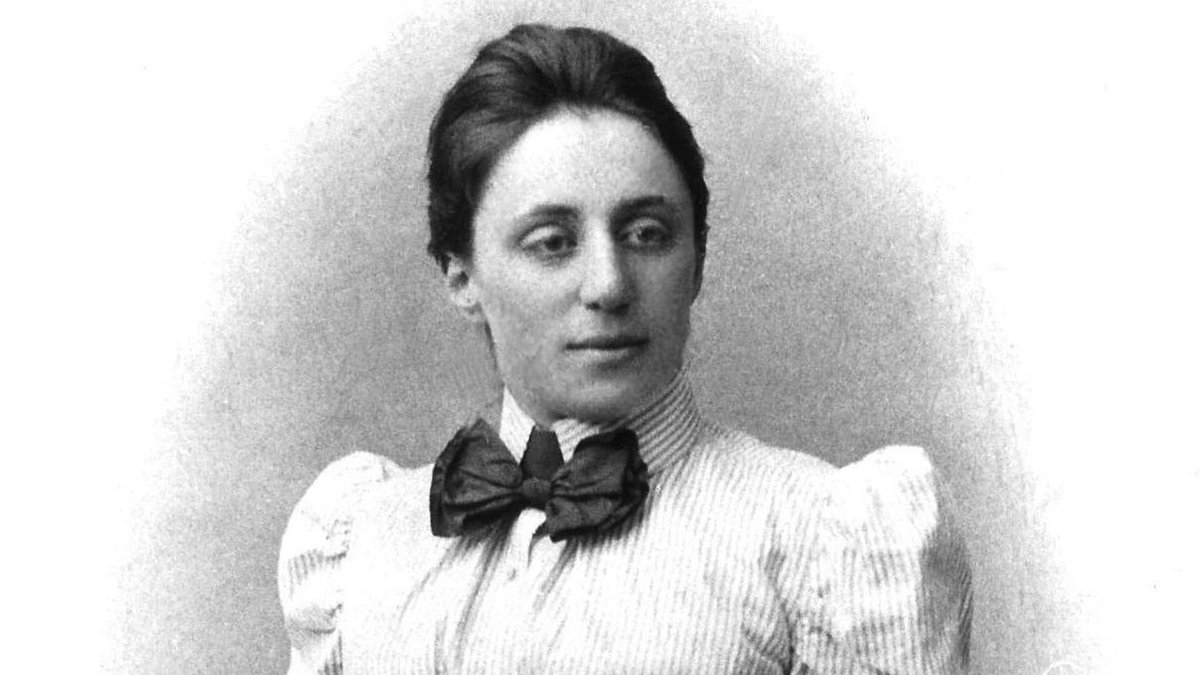 Emmy Noether was a German mathematician born in 1882. She developed 'Noether's Theorem' while working at the University of Gottingen in 1915. She was dismissed from the University when Hitler came to power in 1933 and continued teaching for free from her own home 📚✏️